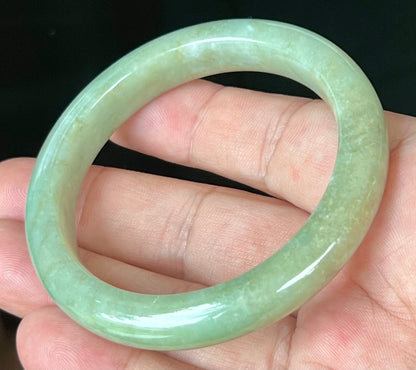 Rounded classic profile of 55.5mm icy apple green Burmese jade bangle JB558