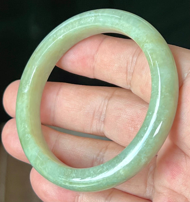 Rounded classic profile of 55.5mm icy apple green Burmese jade bangle JB558