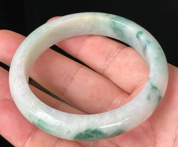 Flat inner and round outer edges of 58.5mm icy imperial green and honeycomb Burmese jade bangle JB214