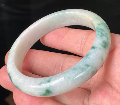 Flat inner and round outer edges of 58.5mm icy imperial green and honeycomb Burmese jade bangle JB214
