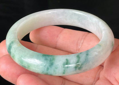 Flat inner and round outer edges of 58.5mm icy imperial green and honeycomb Burmese jade bangle JB214