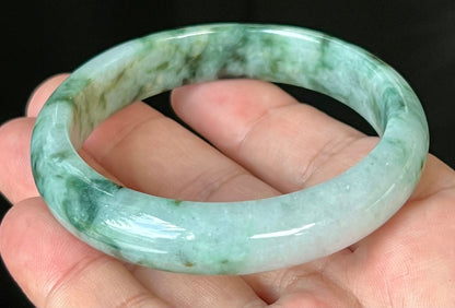 Rounded classic profile of 57.7mm icy apple green and black Burmese jade bangle JB561