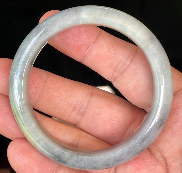 Rounded classic profile of 57mm icy grey, milky white and honey Burmese jade bangle JB358
