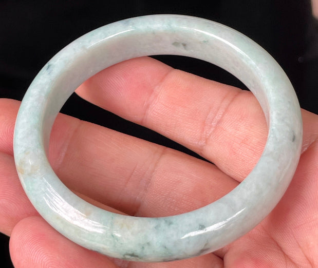 Rounded classic profile of 53mm icy apple green, white and honey brown Burmese jade bangle JB355