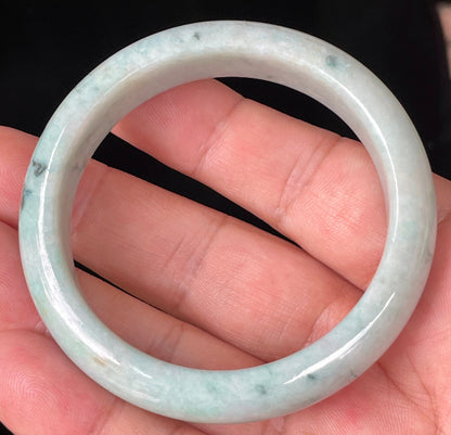 Rounded classic profile of 53mm icy apple green, white and honey brown Burmese jade bangle JB355