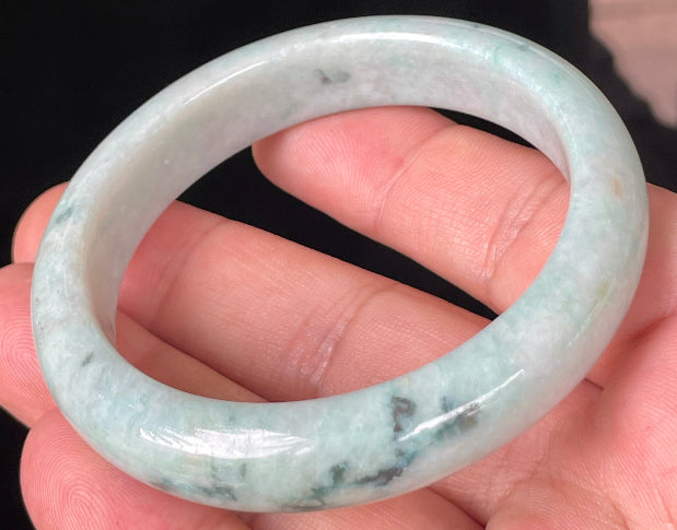 Rounded classic profile of 53mm icy apple green, white and honey brown Burmese jade bangle JB355