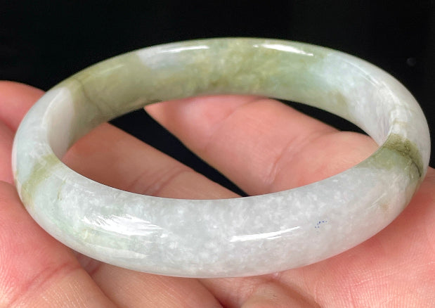 Rounded classic profile of 57mm icy greyish white and apple green Burmese jade bangle JB360