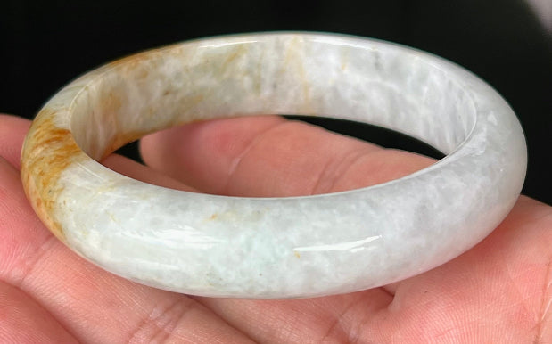 Rounded classic profile of 58.4mm icy greyish white and honey Burmese jade bangle JB531