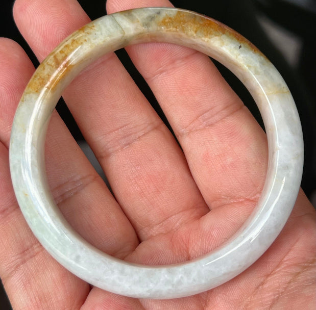 Rounded classic profile of 58.4mm icy greyish white and honey Burmese jade bangle JB531