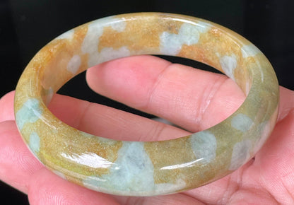 Rounded classic profile of 58.4mm icy honey, brown and bluish white Burmese jade bangle JB075