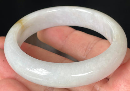 Rounded classic profile of 57mm icy lavender, milky white and honey Burmese jade bangle JB359