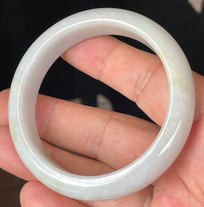 Rounded classic profile of 57mm icy lavender, milky white and honey Burmese jade bangle JB359