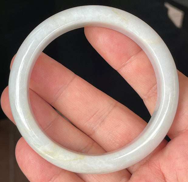 Rounded classic profile of 57mm icy lavender, milky white and honey Burmese jade bangle JB359