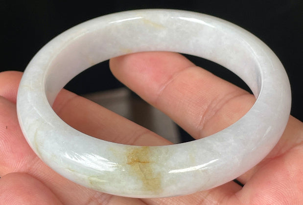 Rounded classic profile of 57mm icy lavender, milky white and honey Burmese jade bangle JB359