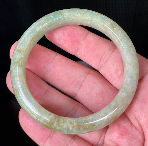 Flat inner and round outer edges of 58.2mm icy apple green, milky white, and honey brown Burmese jade bangle JB830