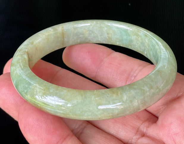 Flat inner and round outer edges of 58.2mm icy apple green, milky white, and honey brown Burmese jade bangle JB830