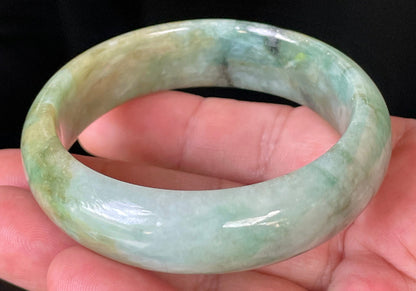 Rounded classic profile of 55mm icy bluish apple green, honey and milky white Burmese jade bangle JB233