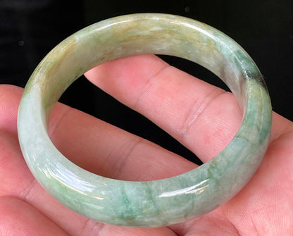 Rounded classic profile of 55mm icy bluish apple green, honey and milky white Burmese jade bangle JB233
