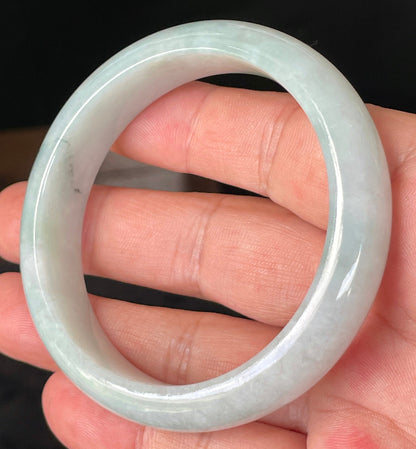 Rounded classic profile of 58.8mm icy greyish white, light apple green and bluish Burmese jade bangle JB231