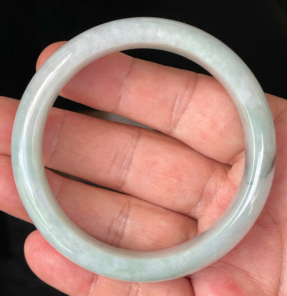 Rounded classic profile of 58.8mm icy greyish white, light apple green and bluish Burmese jade bangle JB231