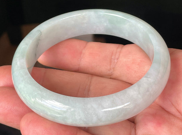 Rounded classic profile of 58.8mm icy greyish white, light apple green and bluish Burmese jade bangle JB231