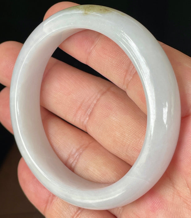 Rounded classic profile of 53.4mm icy white, green and honey Burmese jade bangle JB354