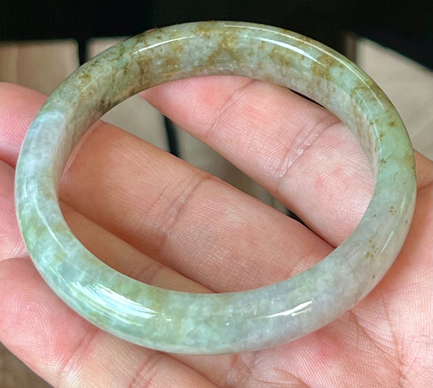Rounded classic profile of 58.8mm icy grayish white, green and honey Burmese jade bangle JB512