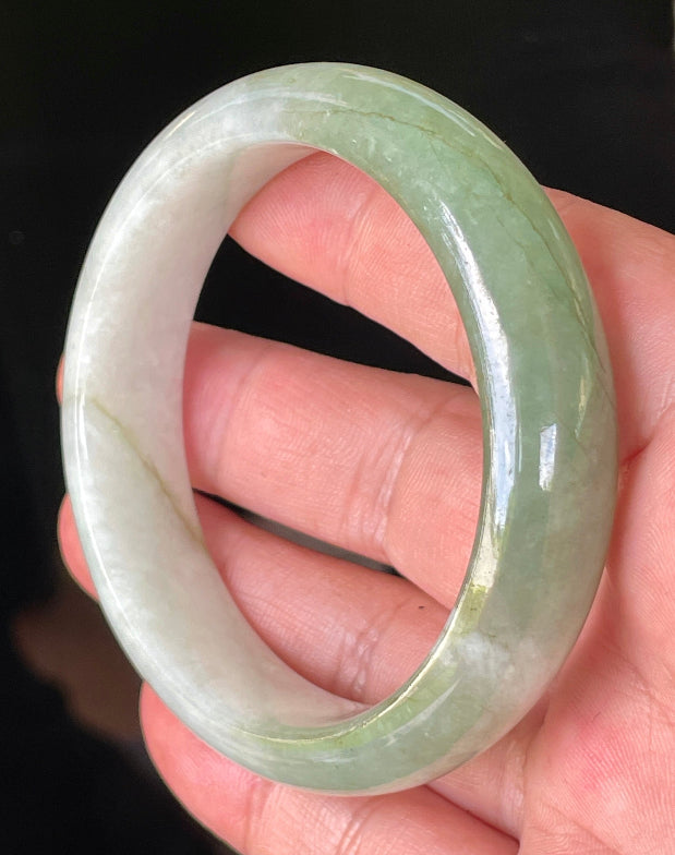 Rounded classic profile of 56.6mm icy milky white and apple green Burmese jade bangle JB151