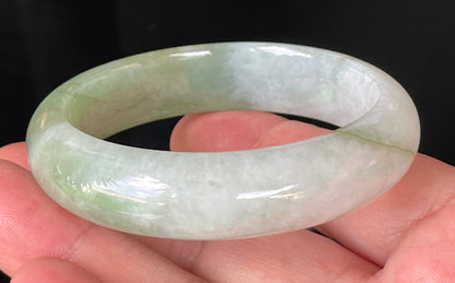 Rounded classic profile of 56.6mm icy milky white and apple green Burmese jade bangle JB151