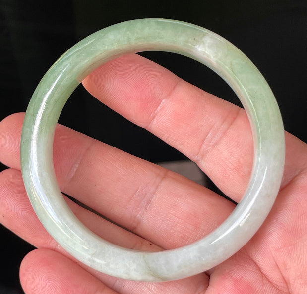 Rounded classic profile of 56.6mm icy milky white and apple green Burmese jade bangle JB151