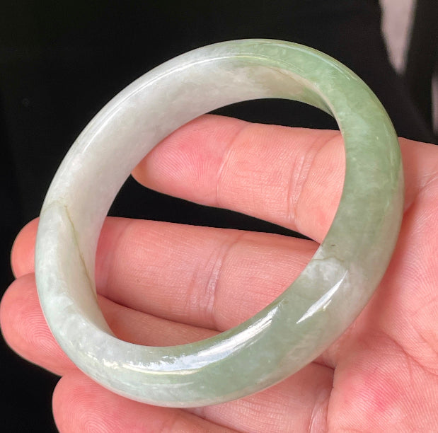 Rounded classic profile of 56.6mm icy milky white and apple green Burmese jade bangle JB151