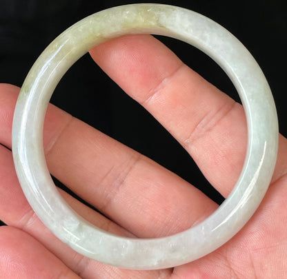 Rounded classic profile of 58.8mm icy milky white and light apple green Burmese jade bangle JB237
