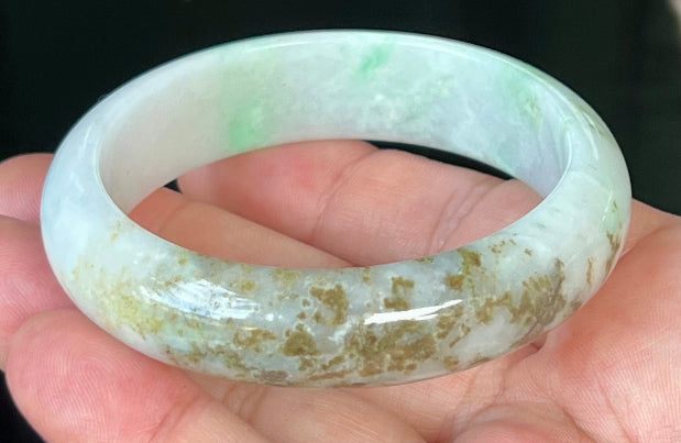 Rounded classic profile of 56.7mm icy white and green Burmese jade bangle JB527