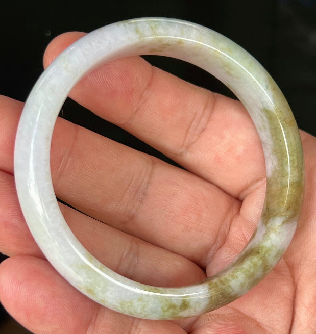 Rounded classic profile of 58.4mm icy white and moss green Burmese jade bangle JB535