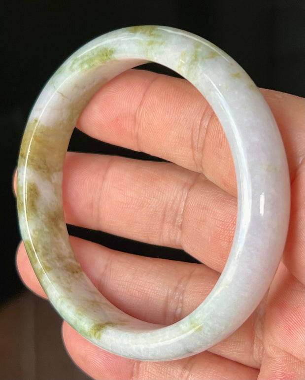 Rounded classic profile of 58.4mm icy white and moss green Burmese jade bangle JB535