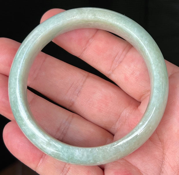 Rounded classic profile of 58.2mm icy light green and milky white Burmese jade bangle JB536