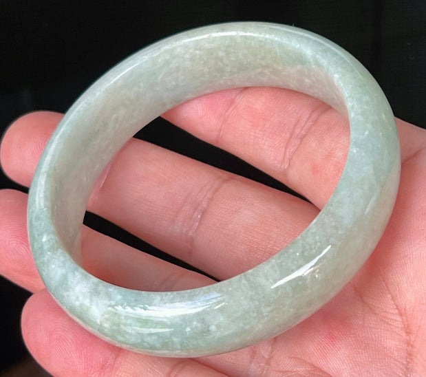 Rounded classic profile of 58.2mm icy light green and milky white Burmese jade bangle JB536