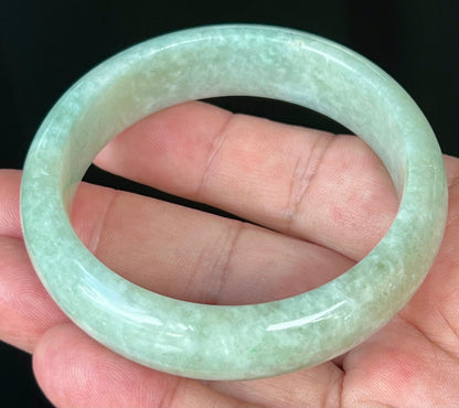 Rounded classic profile of 56.8mm icy green and white Burmese jade bangle JB537