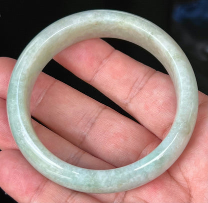Rounded classic profile of 56.8mm icy green and white Burmese jade bangle JB537