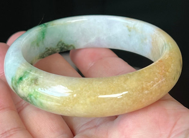 Rounded classic profile of 58mm icy white and honey yellow Burmese jade bangle JB545