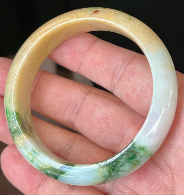Rounded classic profile of 58mm icy white and honey yellow Burmese jade bangle JB545