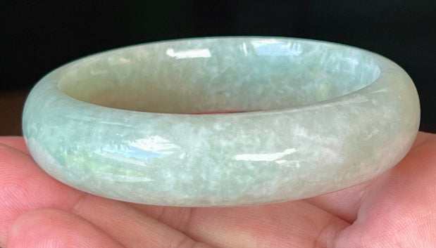 Rounded classic profile of 58.3mm icy green and white Burmese jade bangle JB548