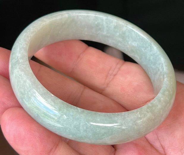 Rounded classic profile of 58.3mm icy green and white Burmese jade bangle JB548