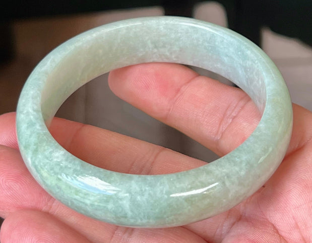 Rounded classic profile of 58.3mm icy green and white Burmese jade bangle JB548
