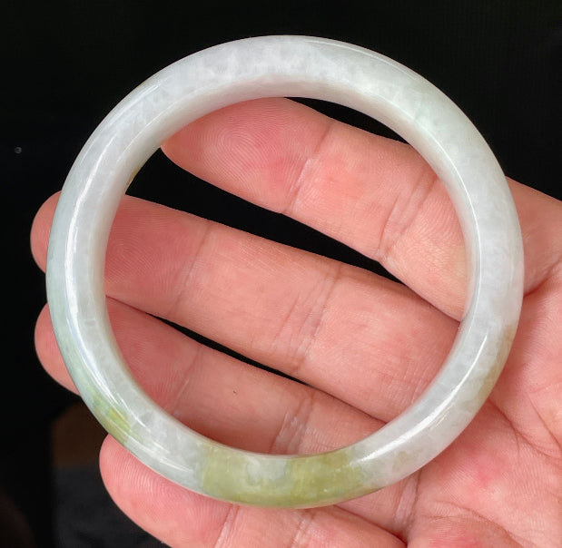 Flat inner and round outer edges of 58.4mm icy greyish white and green Burmese jade bangle JB851