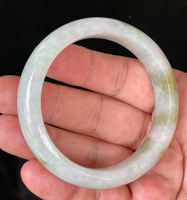 Flat inner and round outer edges of 58.4mm icy greyish white and green Burmese jade bangle JB851