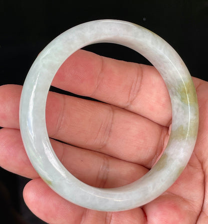 Flat inner and round outer edges of 58.4mm icy greyish white and green Burmese jade bangle JB851