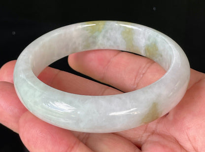 Flat inner and round outer edges of 58.4mm icy greyish white and green Burmese jade bangle JB851