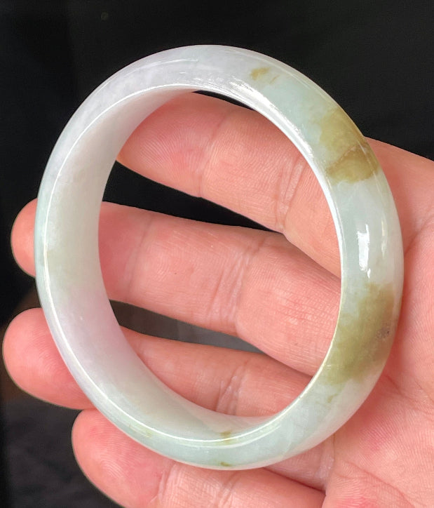 Rounded classic profile of 58.7mm icy milky white, green, and lavender Burmese jade bangle JB226