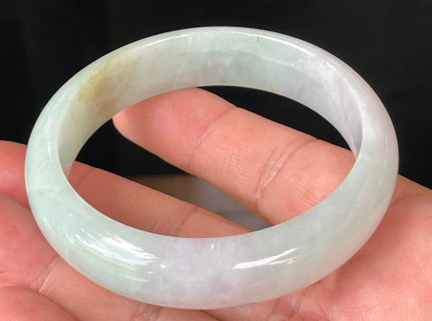 Rounded classic profile of 58.7mm icy milky white, green, and lavender Burmese jade bangle JB226